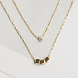 Collares - Doble perla y tres dados