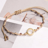 Pulseras Hilo Nudo - Laura Karma Hilo Beige Combinación lila