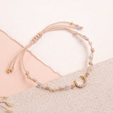 Pulseras Hilo Nudo - Luna Circones Hilo Beige Piedras celestes