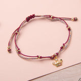 Pulsera Hilo Nudo - Corona circones morado brilloso
