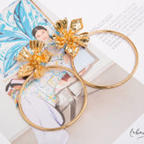Maxi Aretes - Flor dorada argolla